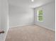 This bedroom has neutral paint, carpet and a window at 208 Cherry Grove Dr, Summerville, SC 29483