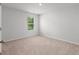 This bedroom has neutral paint, carpet and a window at 208 Cherry Grove Dr, Summerville, SC 29483