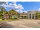 Exterior view of a YMCA building featuring a modern design, palm trees, and ample parking at 208 Cherry Grove Dr, Summerville, SC 29483