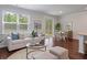 Living room and dining area combination with hardwood floors and lots of sunlight at 208 Cherry Grove Dr, Summerville, SC 29483
