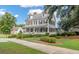 Grand historic-style home with a wide porch, dormer windows, and manicured landscaping for elegant living at 208 Cherry Grove Dr, Summerville, SC 29483