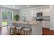 Bright eat-in kitchen features granite counters, stainless appliances, breakfast bar and access to the outdoors at 208 Cherry Grove Dr, Summerville, SC 29483