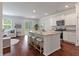 Modern kitchen with a large island, stainless steel appliances, and hardwood floors at 208 Cherry Grove Dr, Summerville, SC 29483