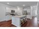 Beautiful kitchen with stainless appliances, center island with bar seating, granite counters, and hardwood floors at 208 Cherry Grove Dr, Summerville, SC 29483