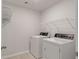 This laundry room comes equipped with a washer and dryer, plus shelving at 208 Cherry Grove Dr, Summerville, SC 29483