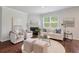 Living room with fireplace, neutral colors, lots of sunlight, and hardwood floors at 208 Cherry Grove Dr, Summerville, SC 29483