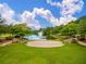 Picturesque park view featuring an outdoor stage, seating, a fountain, and lush greenery at 208 Cherry Grove Dr, Summerville, SC 29483