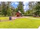 A vibrant playground featuring a swing set, playhouse, and slide in a well-maintained park at 208 Cherry Grove Dr, Summerville, SC 29483