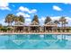 Sparkling blue community pool with clear reflections, featuring stylish cabanas and inviting lounge chairs at 208 Cherry Grove Dr, Summerville, SC 29483