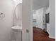 Stylish powder room with a pedestal sink, with view of kitchen in background at 208 Cherry Grove Dr, Summerville, SC 29483