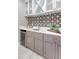 Stylish bar area with beverage fridge, designer backsplash, and counter space for entertaining at 2096 Promenade Ct, Mount Pleasant, SC 29466