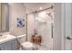Modern bathroom features a glass shower, stylish fixtures, and decorative accents, complemented by natural light at 2096 Promenade Ct, Mount Pleasant, SC 29466