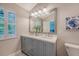 Elegant bathroom boasts a double sink vanity, updated fixtures, and a bright, inviting atmosphere at 2096 Promenade Ct, Mount Pleasant, SC 29466