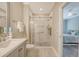 Bright bathroom featuring a shower with glass doors and a vanity at 2096 Promenade Ct, Mount Pleasant, SC 29466