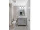 Well-lit bathroom with a modern vanity, framed mirror, and stylish gray accents at 2096 Promenade Ct, Mount Pleasant, SC 29466