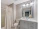 Well-lit bathroom with a modern vanity, framed mirror, and stylish gray accents at 2096 Promenade Ct, Mount Pleasant, SC 29466