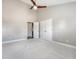 Spacious bedroom featuring neutral tones, plush carpeting, ceiling fan, and a double door closet at 2096 Promenade Ct, Mount Pleasant, SC 29466