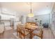 Open concept dining area seamlessly flows into the kitchen and living room with natural lighting at 2096 Promenade Ct, Mount Pleasant, SC 29466