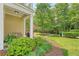 Charming front porch with lush landscaping and view of the walkway at 2096 Promenade Ct, Mount Pleasant, SC 29466