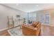 Comfortable living room with a leather sofa, area rug, and neutral decor at 2096 Promenade Ct, Mount Pleasant, SC 29466