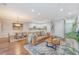 Open concept living room seamlessly flows into the kitchen and dining area at 2096 Promenade Ct, Mount Pleasant, SC 29466