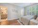 Bedroom with shuttered windows offering views of the exterior and access to bathroom at 2096 Promenade Ct, Mount Pleasant, SC 29466
