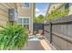 Cozy patio featuring comfortable seating, a privacy fence, and lush greenery, creating an inviting outdoor retreat at 2096 Promenade Ct, Mount Pleasant, SC 29466