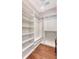 Walk-in closet with custom shelving and hanging rods, providing ample storage space at 2096 Promenade Ct, Mount Pleasant, SC 29466