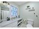 Bathroom featuring a vanity with marble countertop and a stained-glass window at 2134 Landfall Way, Seabrook Island, SC 29455
