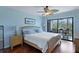 Bedroom with hardwood floors and glass doors that lead to the porch outside at 2134 Landfall Way, Seabrook Island, SC 29455