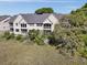 Marsh front condo featuring balconies, greenery, and an outdoor, screened-in patio at 2134 Landfall Way, Seabrook Island, SC 29455
