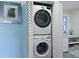 Stackable washer and dryer inside a closet in the bathroom with the stained glass window at 2134 Landfall Way, Seabrook Island, SC 29455