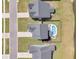 An aerial view shows houses with pools and fences within a residential area at 214 Squire Pope Rd, Summerville, SC 29486