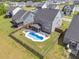 An aerial view of a fenced backyard with a private pool and outdoor seating at 214 Squire Pope Rd, Summerville, SC 29486