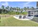 Expansive backyard with a swimming pool, screened porch, and lush green lawn at 214 Squire Pope Rd, Summerville, SC 29486