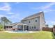 Spacious backyard featuring a pool, screened porch, and well-maintained lawn at 214 Squire Pope Rd, Summerville, SC 29486