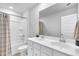 Clean bathroom featuring double sinks, a tub with shower, and neutral decor at 214 Squire Pope Rd, Summerville, SC 29486