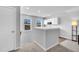 Bright bonus room with beverage center, white cabinets, and an undermount stainless sink at 214 Squire Pope Rd, Summerville, SC 29486
