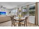 Cozy breakfast nook with a round table, four chairs, and natural light from nearby windows at 214 Squire Pope Rd, Summerville, SC 29486