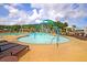 Community pool area featuring lounge chairs, shade umbrellas, and a water feature at 214 Squire Pope Rd, Summerville, SC 29486