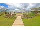 Beautiful community space with a pergola, benches, landscaping, and a walkway on a sunny day with blue skies at 214 Squire Pope Rd, Summerville, SC 29486