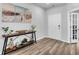 Inviting entryway with modern decor, stylish console table, and wood-look floors at 214 Squire Pope Rd, Summerville, SC 29486