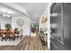 Entryway featuring an open dining room, a console table, and hardwood floors leading to the living area at 214 Squire Pope Rd, Summerville, SC 29486
