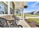 A cozy front porch has wicker chairs and hanging baskets at 214 Squire Pope Rd, Summerville, SC 29486