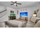 Comfortable living room featuring a large television, staircase, and plush seating with ample natural light at 214 Squire Pope Rd, Summerville, SC 29486