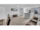 Spacious living room features plush sofa, ceiling fan, and bar area at 214 Squire Pope Rd, Summerville, SC 29486