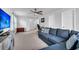 Spacious living room with a large blue sectional sofa and an open doorway to an office at 214 Squire Pope Rd, Summerville, SC 29486