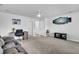 Living room features plush sofa, ceiling fan, and access to bedrooms and bathroom at 214 Squire Pope Rd, Summerville, SC 29486