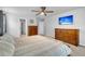 The main bedroom features carpeted floors, wood furniture, and neutral wall color at 214 Squire Pope Rd, Summerville, SC 29486