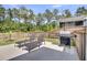 Outdoor patio offers lounge chairs and grill within a fenced yard at 214 Squire Pope Rd, Summerville, SC 29486